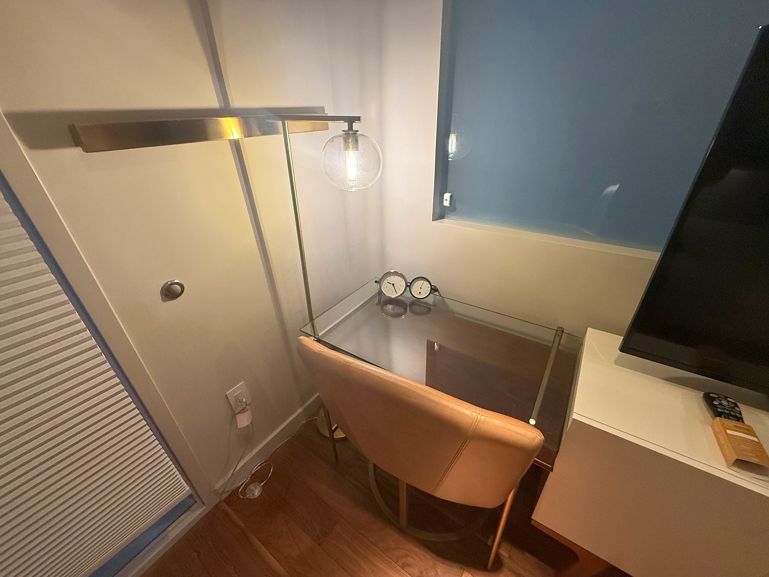 Desk seating and pendant beside the television