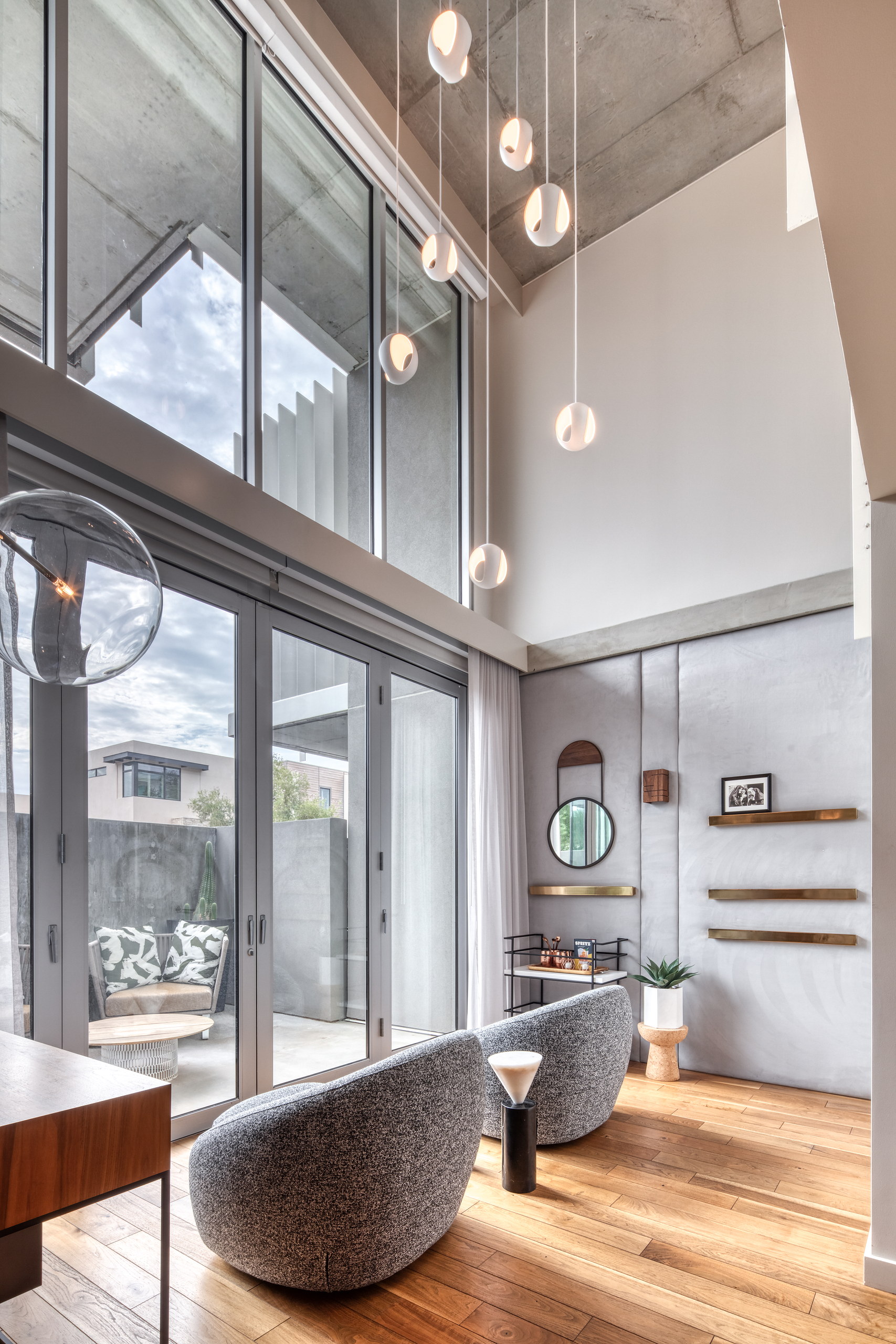 Sitting room beneath the double-height pendant installation