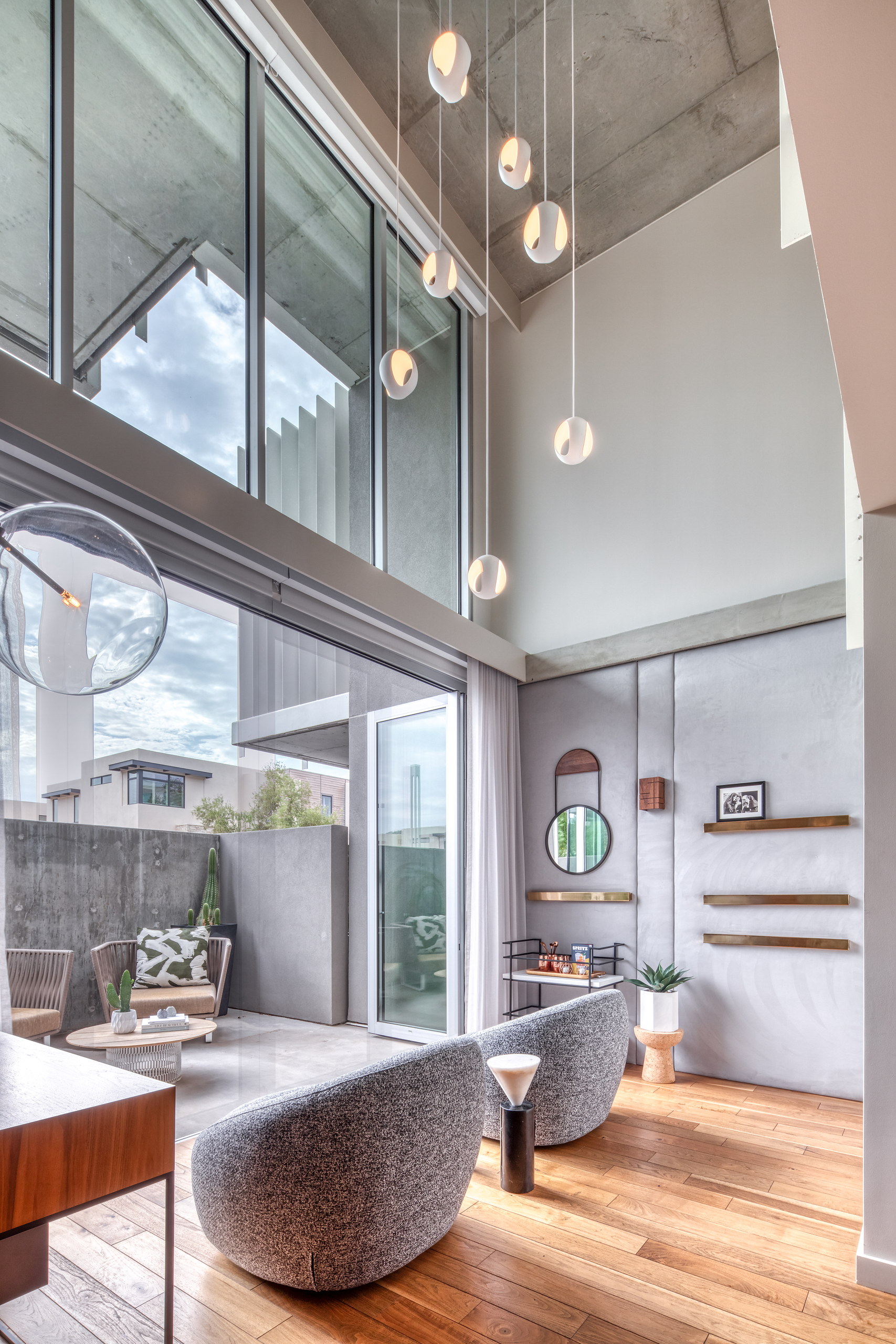 Swivel lounge chairs against the glass wall