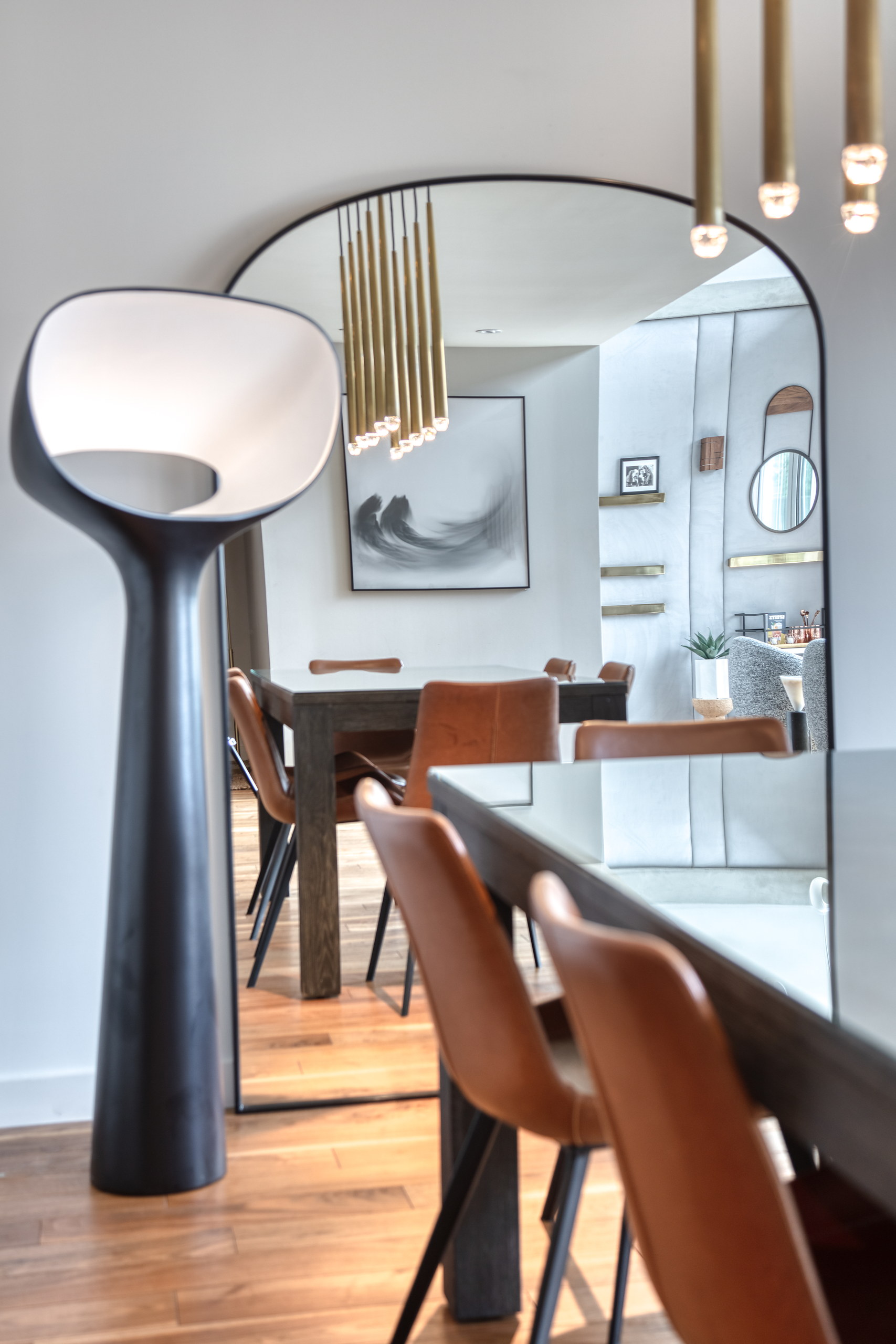Detail of the dining chairs and brass pendant